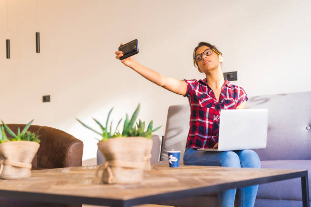 istock Woman taking a selfie while working at home 1798212197