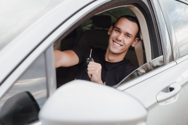 istock Happy man driver holding key from his car 1798213872