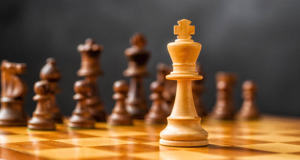 istock Chess pieces on a chessboard - Focus on the King 1798216533