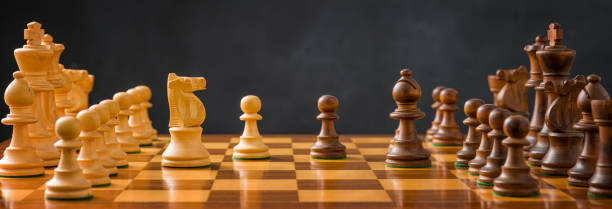 istock Chess pieces on a chessboard with a dark background 1798217610