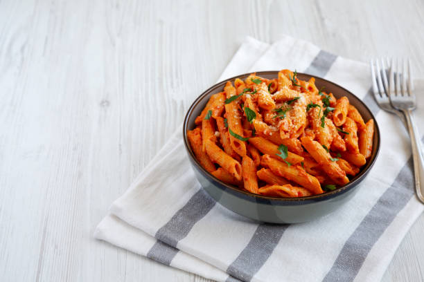 istock Homemade Penne Alla Vodka from Leftover Sauce with Cheese and Parsley, low angle view. Space for text. 1798218668