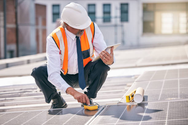 istock Tablet, solar panels and engineering man on rooftop, city and urban development, sustainability or energy saving installation. Digital technology, inspection and electrician or person with power grid 1798225977