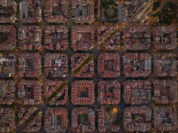 Photo of Aerial shot of buildings blocks and urban streets in Barcelona, Spain.