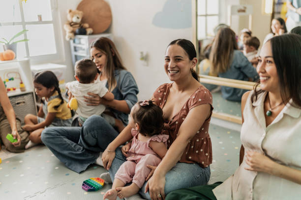 istock Mothers playing with their babies in a support group therapy on a playroom 1798238439