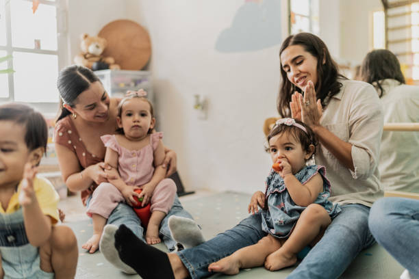 istock Mothers playing with their babies in a support group therapy on a playroom 1798238462