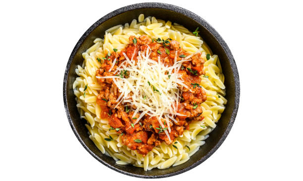 istock Bolognese pasta, risone with ground beef in a plate.  Isolated, white background. 1798253768