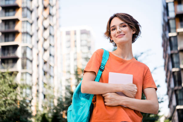 Photo of pretty cute girl dressed stylish clothes going to university sunny september days stock photo