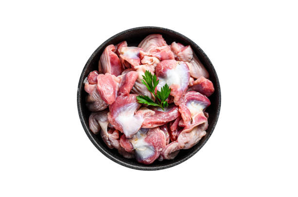 istock Raw uncooked chicken gizzards, stomach in a pan.  Isolated, white background. 1798267903