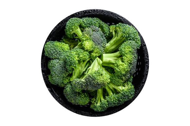 istock Organic Raw green broccoli cabbage  in a colander. Isolated, white background. 1798268434