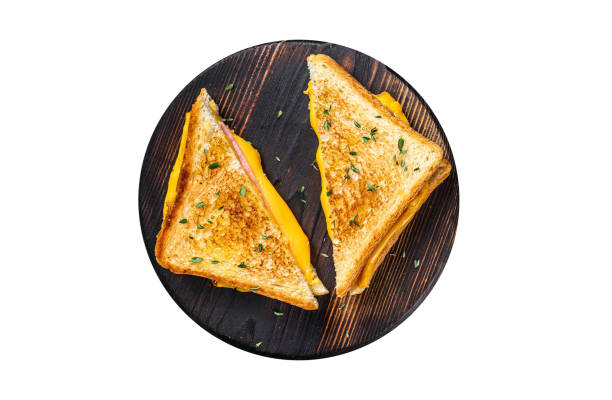 American ham and melted cheese sandwich.  Isolated, white background.