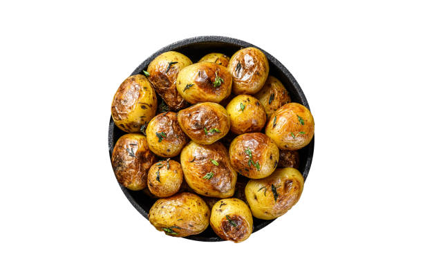 istock Baked youg potato with thyme in a pan Isolated, white background. 1798268472
