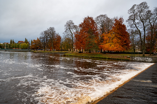 The Black river running through Orebro city center near the castle Orebro Sweden November 14 2023