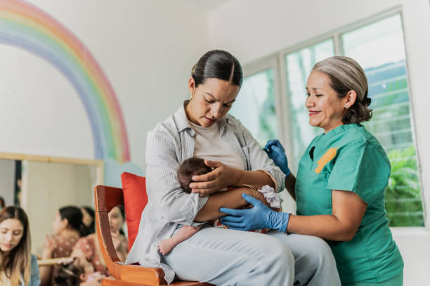 istock Mature woman learning to breastfeed her daughter in support group 1798280290
