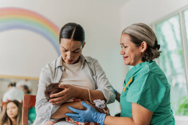 istock Mature woman learning to breastfeed her daughter in support group 1798280441