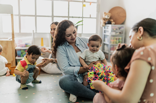 Mother playing with her son in the playroom