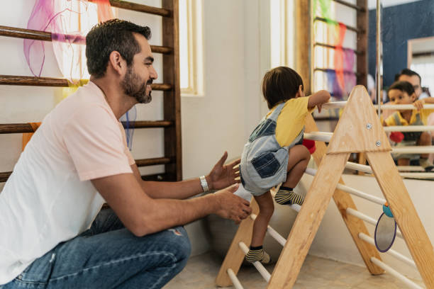 Father and son playing in the playroom