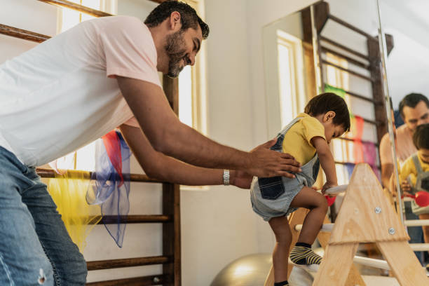 istock Father and son playing in the playroom 1798284884