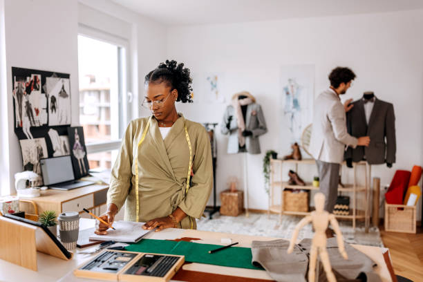 istock Young beautiful woman working at clothing design studio 1798287025