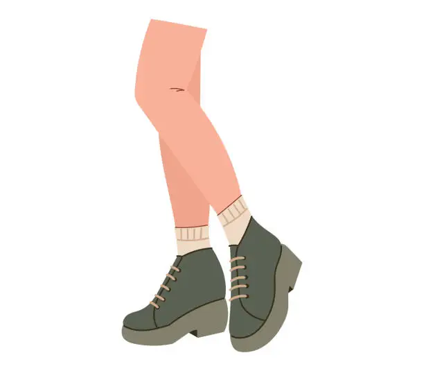 Vector illustration of Beautiful female legs in stylish boots. Vector isolated flat fashion shoe illustration.