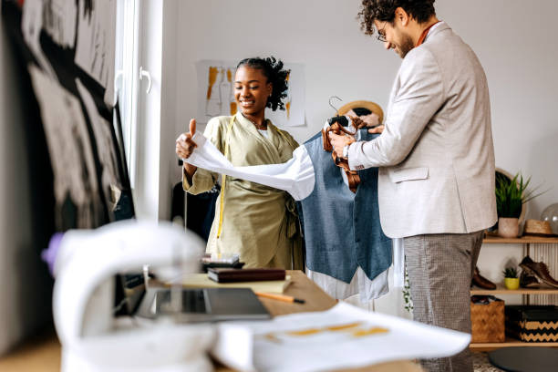 istock Two clothing designers working together at tailor workshop 1798288685
