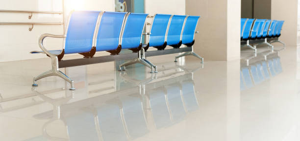 istock Empty chairs in hospital hallway 1798296454