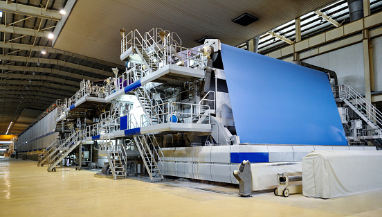 Large paper mill machine in the workshop