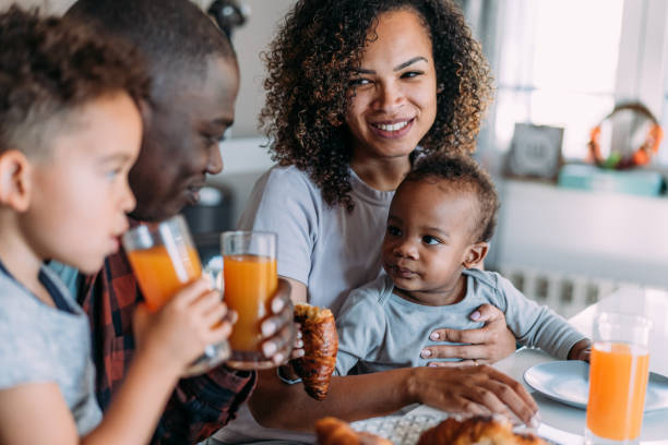 istock Happy family having breakfast at home. 1798298126