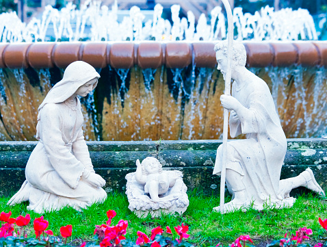 Nativity Scene clay figurines set by public fountain. Town square  and public park in Vigo, Pontevedra province,  Galicia, Spain.