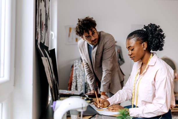 istock Clothing designers working together at tailor workshop 1798300912