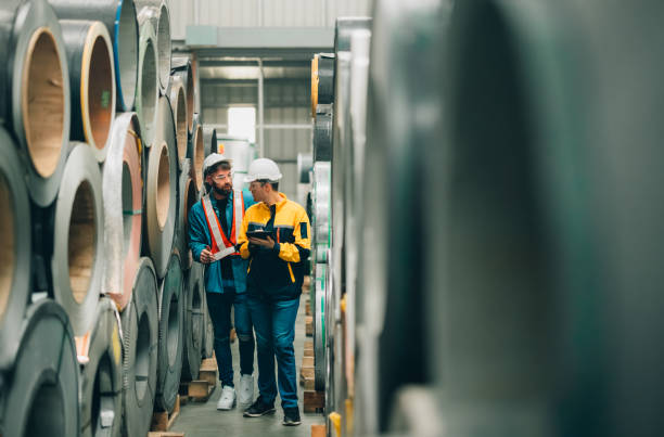 istock Metal sheet workers perform routine quality checking, enhancing assurance in roofing infrastructure 1798330284