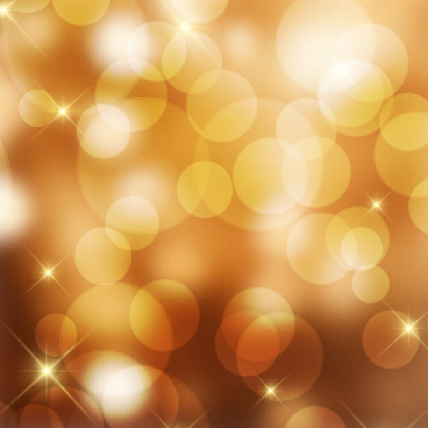istock Golden bokeh lights and stars Christmas background 1798335894