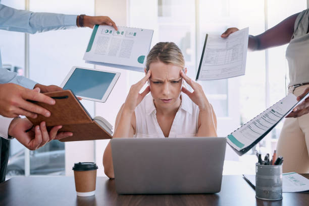 istock Work stress, headache and burnout mindset of a business woman working at a office computer. Corporate tax employee worried about mental health from job report, contract and compliance data overload 1798342309