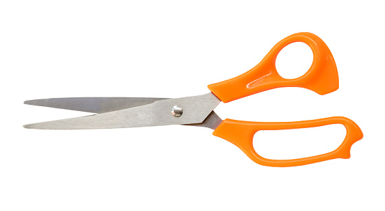 Single yellow or orange scissors is isolated on white background with clipping path.