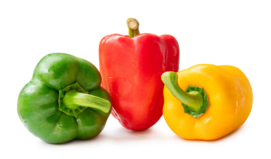 Three fresh beautiful wet bell pepper with drop are isolated on white background with clipping path. Sweet paprika chili