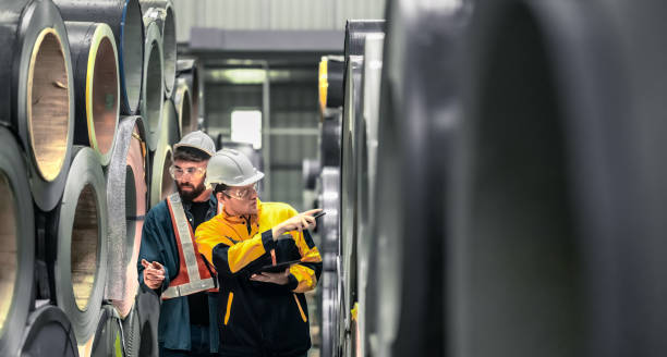 istock Metal sheet workers perform routine quality checking, enhancing assurance in roofing infrastructure 1798367445