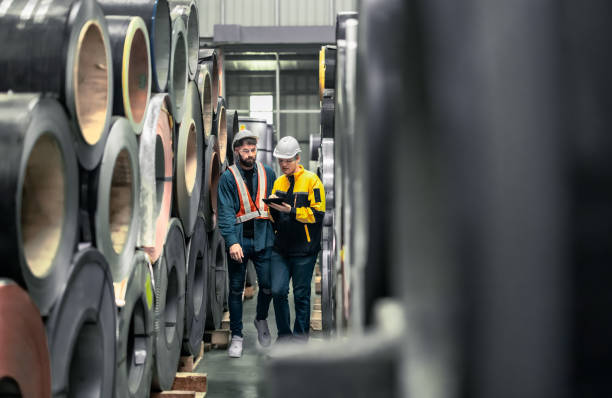 istock Metal sheet workers perform routine quality checking, enhancing assurance in roofing infrastructure 1798371713