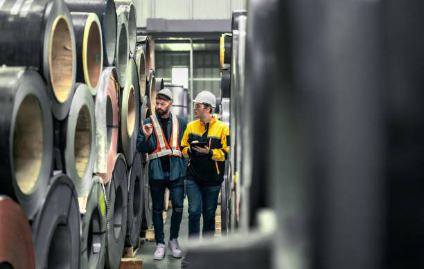 istock Metal sheet workers perform routine quality checking, enhancing assurance in roofing infrastructure 1798371716