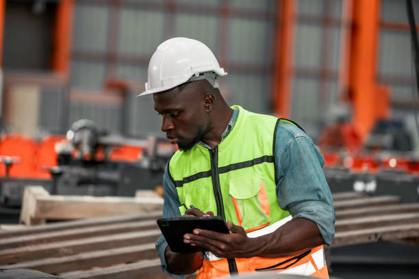 istock Metal sheet workers perform routine quality checking, enhancing assurance in roofing infrastructure 1798381168