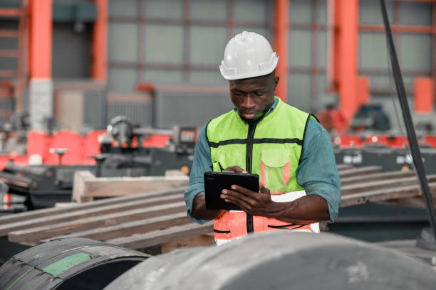 istock Metal sheet workers perform routine quality checking, enhancing assurance in roofing infrastructure 1798382365