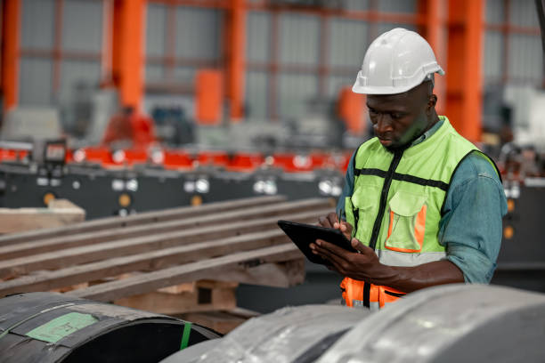 istock Metal sheet workers perform routine quality checking, enhancing assurance in roofing infrastructure 1798382781