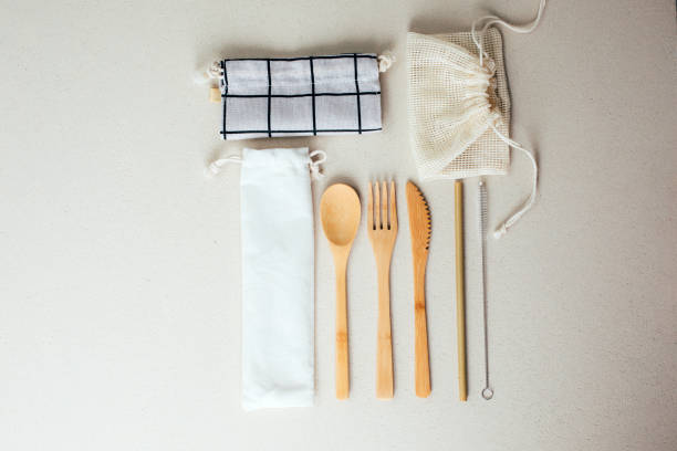 istock Different fabric bags for storage on a gray background. Eco bags for multiple use. A reusable straws, wooden cutlery 1798387725