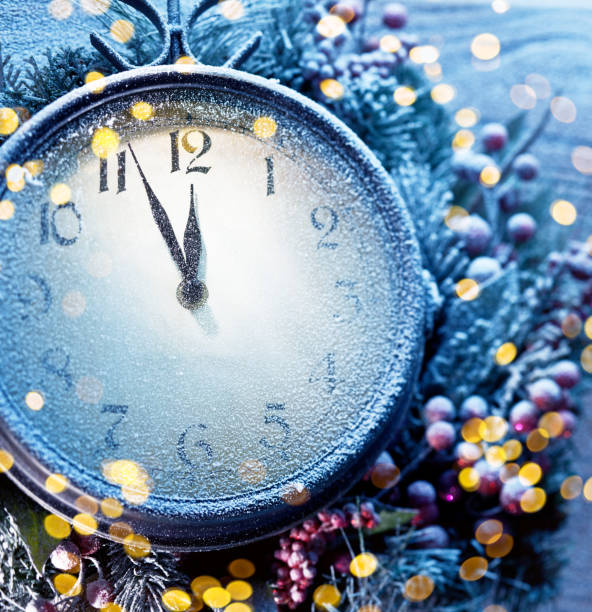 istock Countdown Christmas midnight. Christmas clock covered with fresh snow shows five to twelve. 1798422917