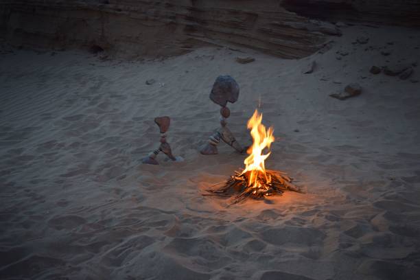 istock Balanced rocks with the campfire on the beach 1798466374