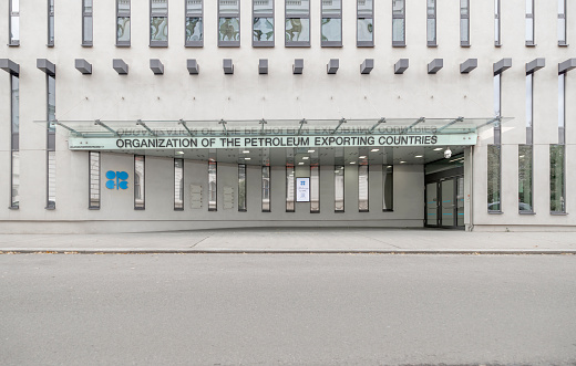 Photograph of the OPEC headquarters in Vienna, Austria, featuring the organization's logo on a banner.