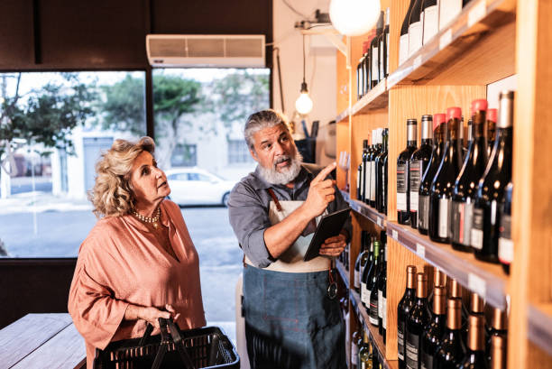 istock Salesman helping customer in a liquor store 1798486877