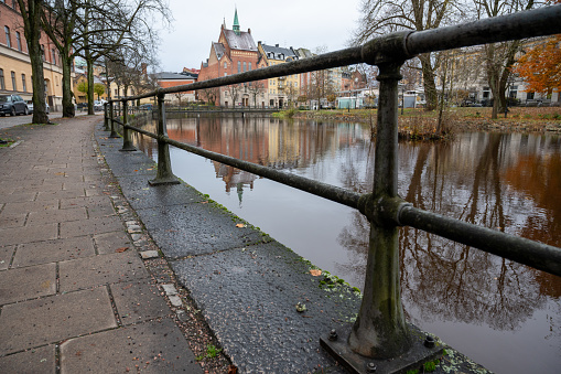 Pavement and railing near infront of Black river Orebro November 14 2023