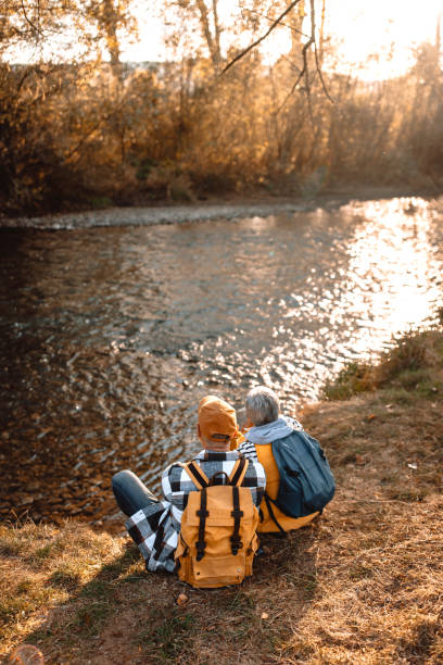istock Senior couple enjoying sunset by the river 1798502701