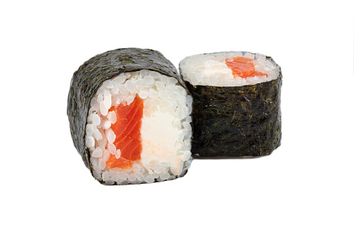 Sushi closeup isolated on white background. Nori seaweed sushi with trout rice and Philadelphia cheese.