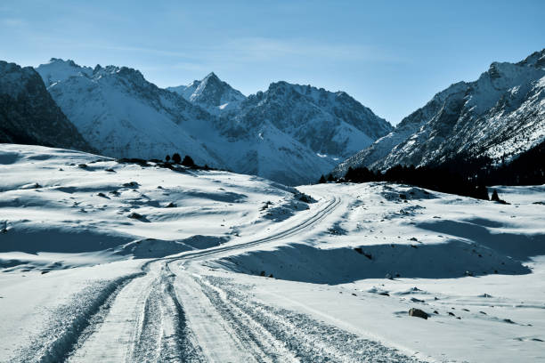 istock Snow road in winter mountain gorge 1798513326