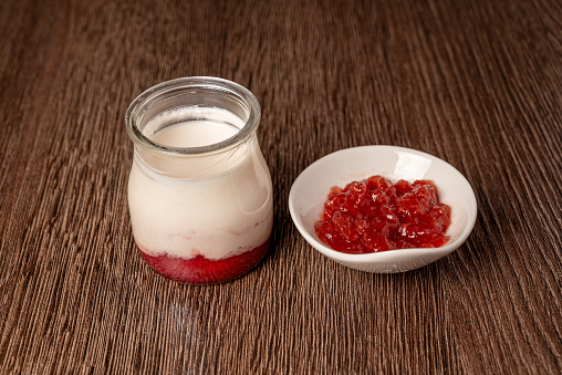 Jar of Greek yogurt with strawberry jam